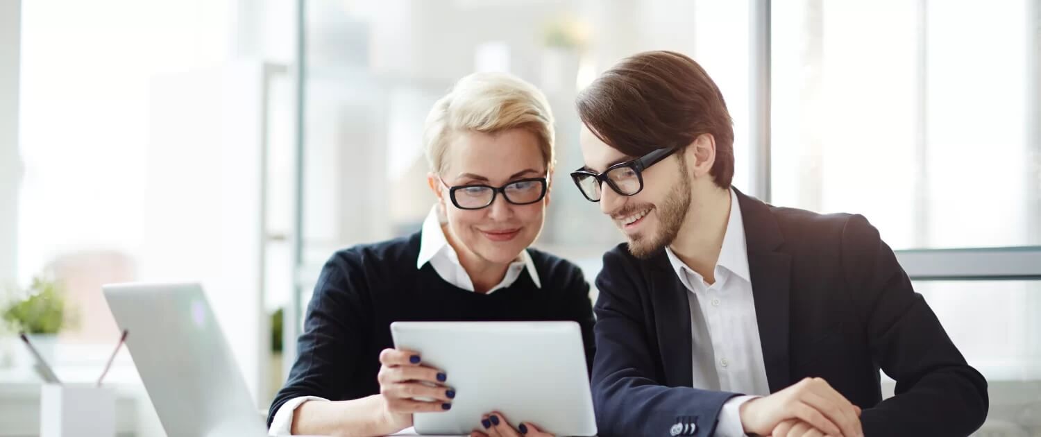 Business professionals reviewing performance reports